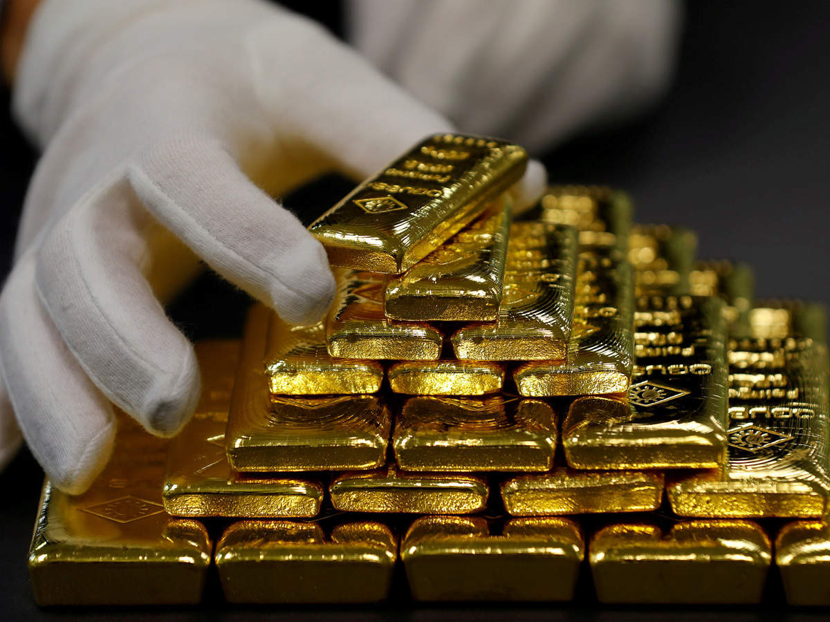 Gold Falls , Dollar Rises